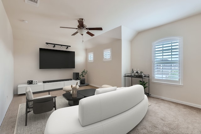 carpeted living room with lofted ceiling and ceiling fan