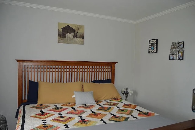 bedroom with ornamental molding