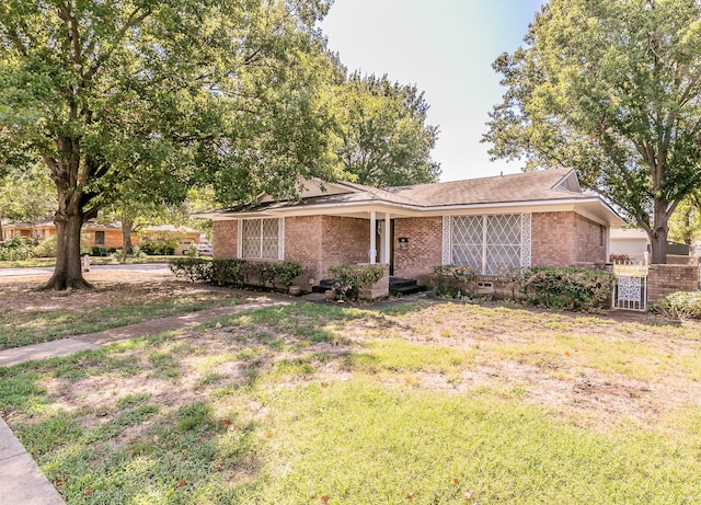 ranch-style home with a front yard