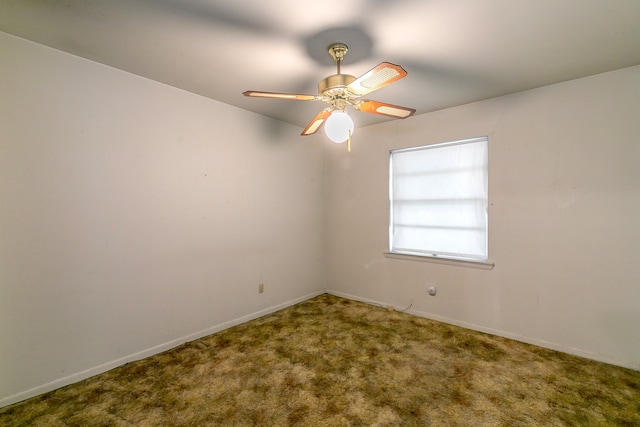 spare room featuring carpet flooring and ceiling fan