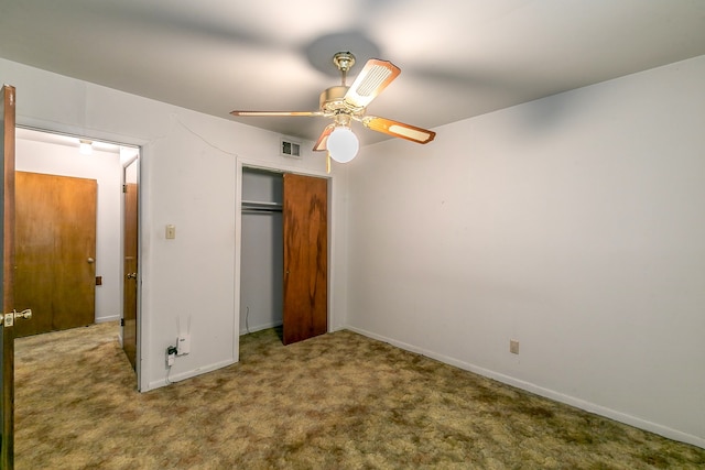 unfurnished bedroom with a closet, ceiling fan, and carpet