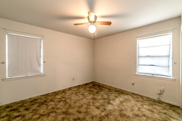 spare room with ceiling fan and carpet floors