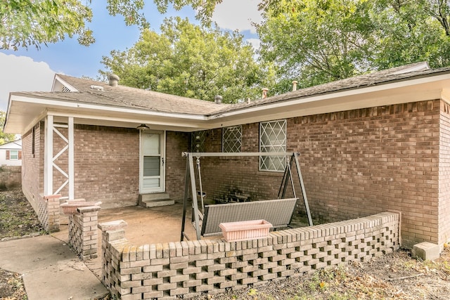 back of property featuring a patio area