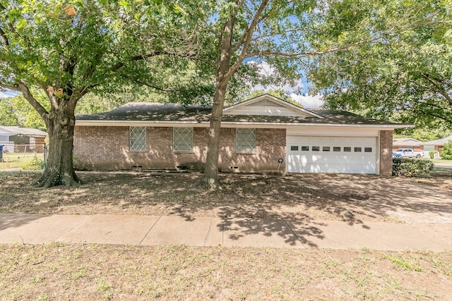 ranch-style house featuring a garage