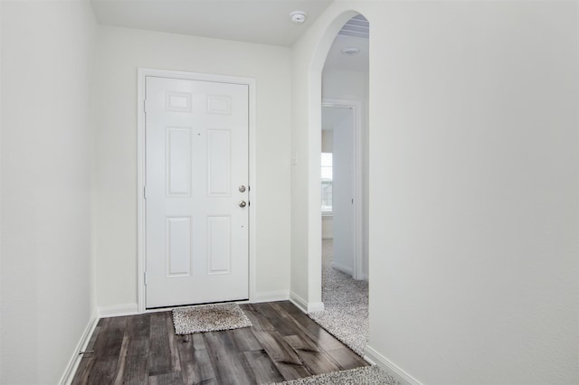 entryway featuring dark wood-type flooring