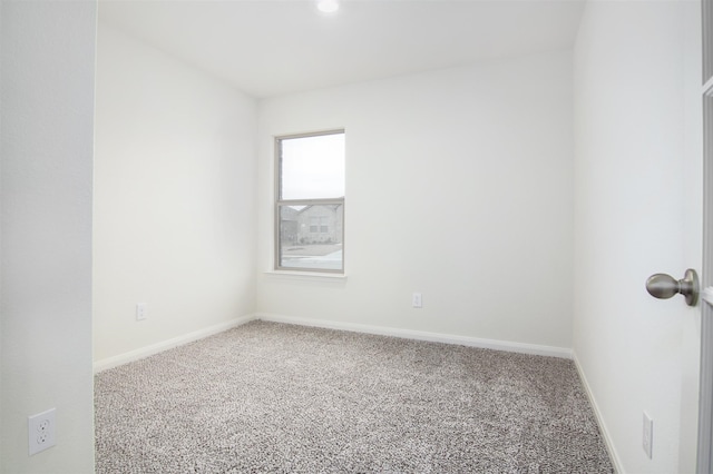 unfurnished room featuring carpet floors