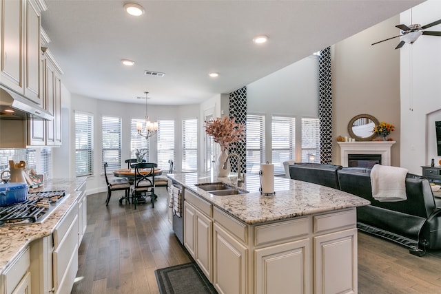 kitchen featuring dark hardwood / wood-style flooring, hanging light fixtures, a healthy amount of sunlight, and sink