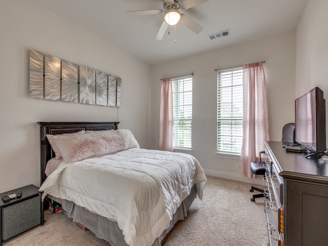 bedroom featuring ceiling fan and light carpet