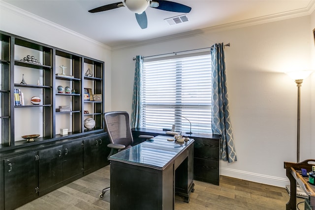 office featuring hardwood / wood-style flooring, ceiling fan, and crown molding