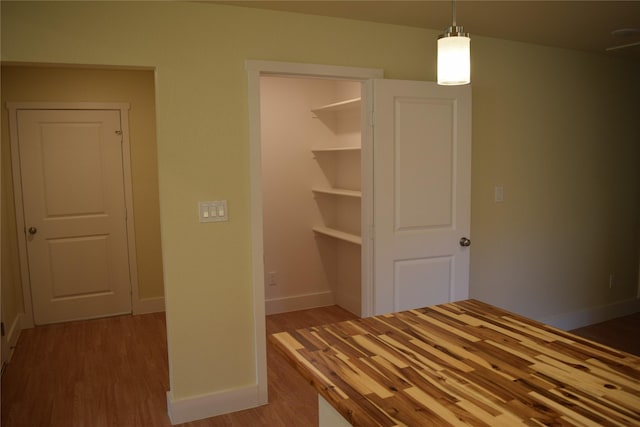 unfurnished bedroom with hardwood / wood-style flooring