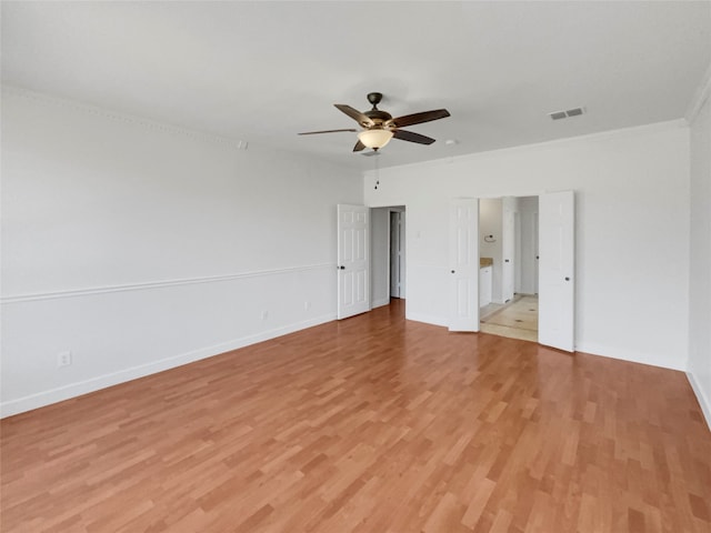 unfurnished bedroom with light hardwood / wood-style flooring, ceiling fan, and ornamental molding