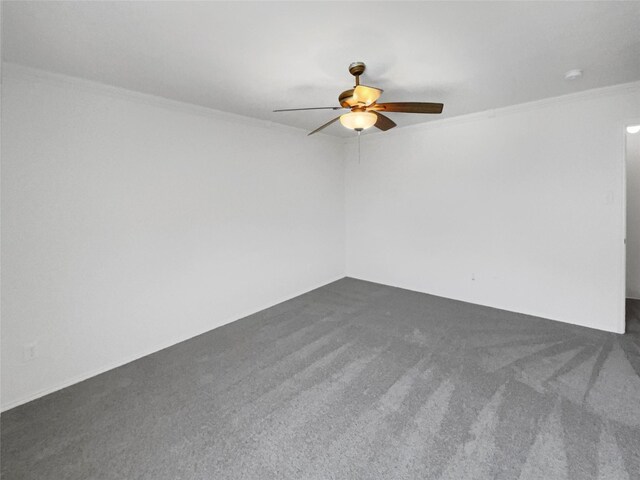 empty room featuring carpet flooring, ceiling fan, and crown molding