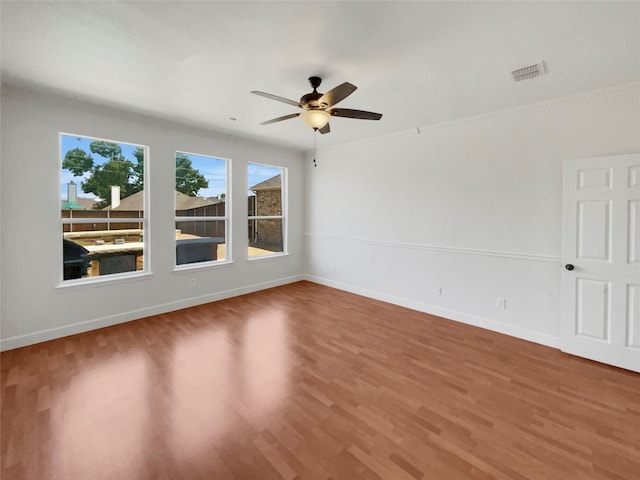 unfurnished room featuring hardwood / wood-style floors and ceiling fan