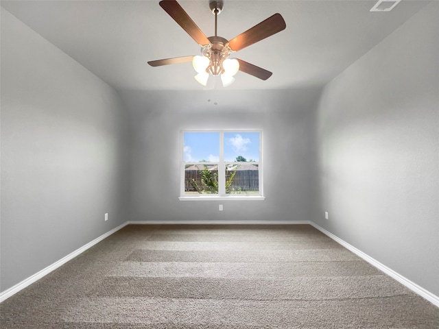 carpeted spare room with lofted ceiling and ceiling fan