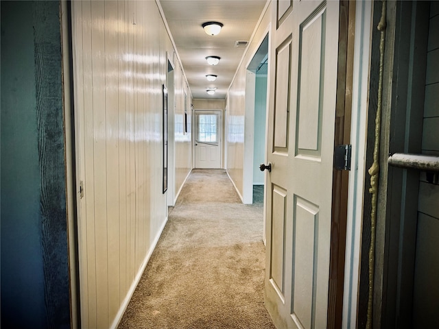 hallway featuring light carpet