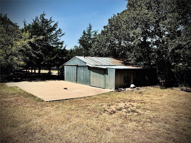 view of outbuilding featuring a lawn