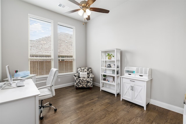 home office with dark hardwood / wood-style flooring and ceiling fan