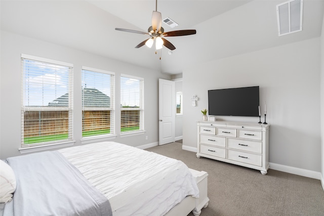 bedroom featuring ceiling fan, light colored carpet, and vaulted ceiling