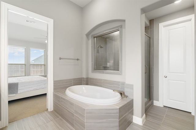 bathroom with tile patterned flooring, ceiling fan, and separate shower and tub