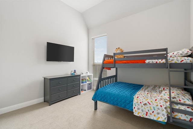 carpeted bedroom featuring vaulted ceiling