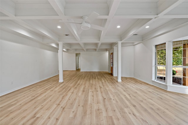 basement featuring ceiling fan and light hardwood / wood-style flooring