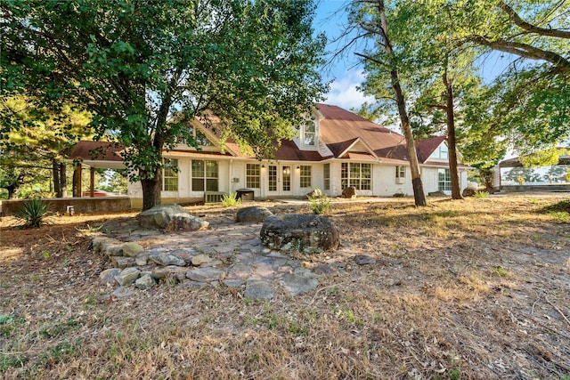 rear view of property featuring a patio and central air condition unit