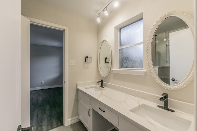 bathroom featuring hardwood / wood-style flooring and vanity