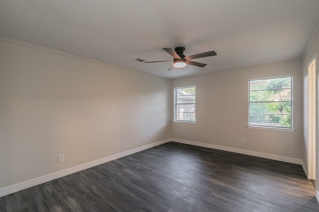 unfurnished room featuring a healthy amount of sunlight, dark hardwood / wood-style floors, ceiling fan, and ornamental molding