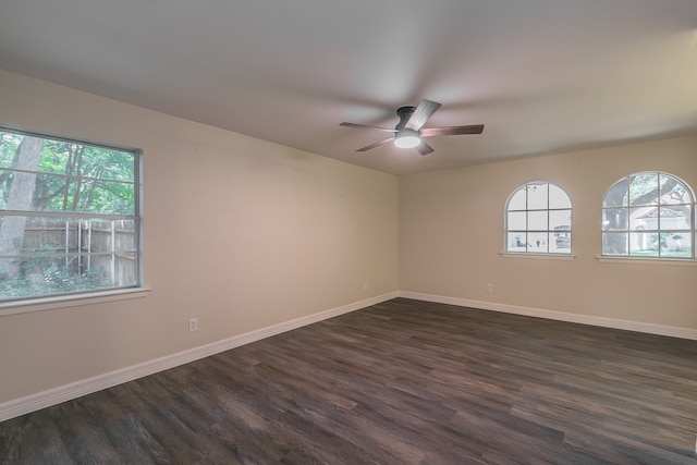 unfurnished room featuring dark hardwood / wood-style floors and ceiling fan