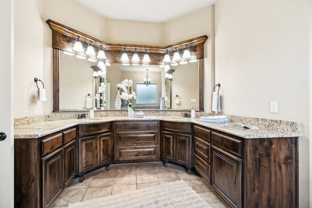 bathroom with vanity and a notable chandelier