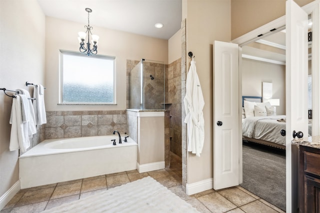 bathroom featuring vanity, independent shower and bath, and a notable chandelier