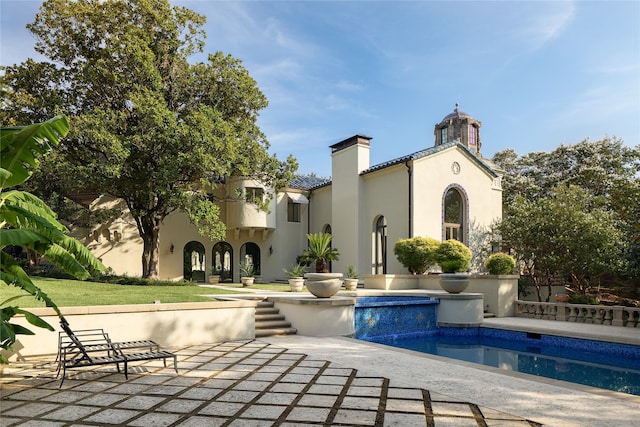 rear view of house featuring a patio