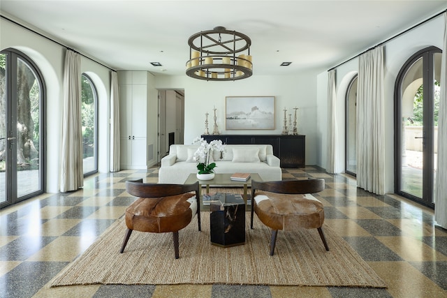 interior space with expansive windows and a chandelier