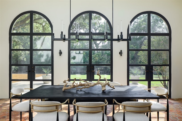 dining area featuring a healthy amount of sunlight and french doors