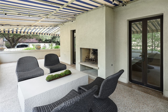 view of patio / terrace featuring an outdoor fireplace