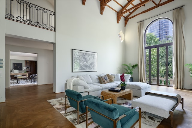 living room with wood-type flooring, high vaulted ceiling, and beam ceiling