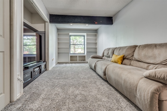 carpeted living room featuring a textured ceiling and beam ceiling