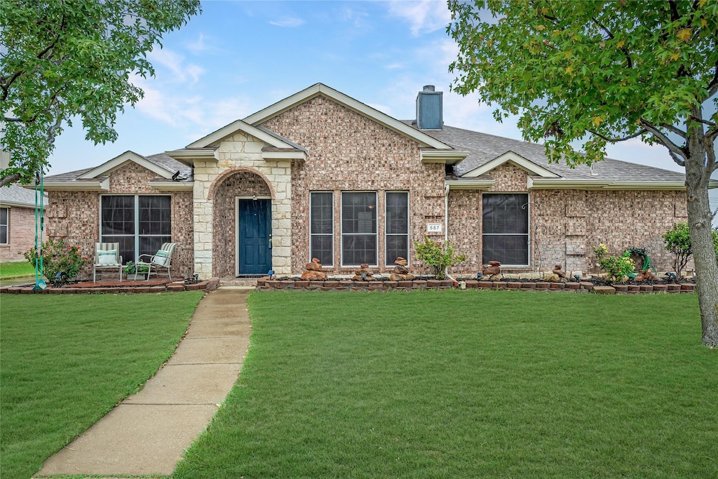 ranch-style house with a front yard