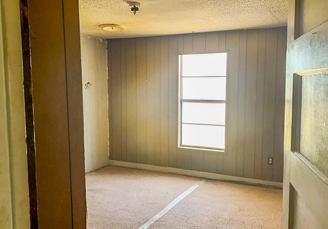 spare room with a textured ceiling