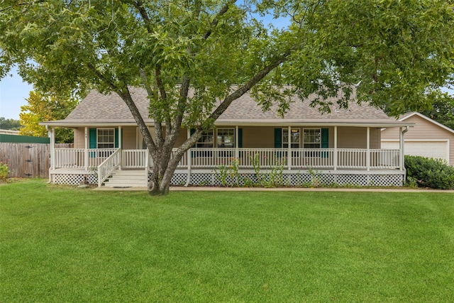 view of front of house with covered porch and a front lawn