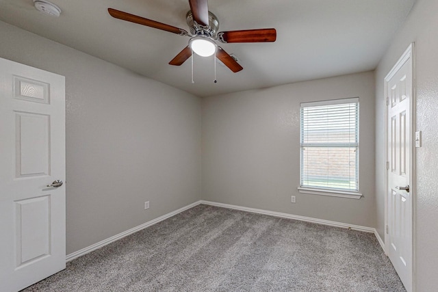 carpeted empty room with ceiling fan