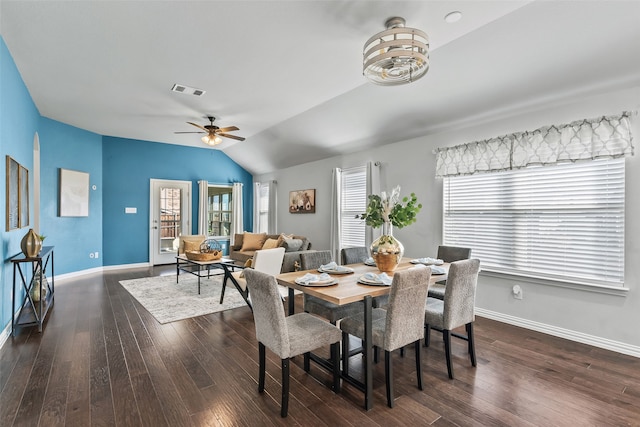 dining room featuring ceiling fan, dark hardwood / wood-style flooring, and lofted ceiling