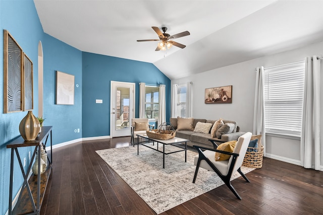 living room with ceiling fan, dark hardwood / wood-style flooring, and vaulted ceiling