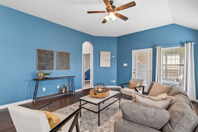 living room featuring hardwood / wood-style floors, ceiling fan, and vaulted ceiling