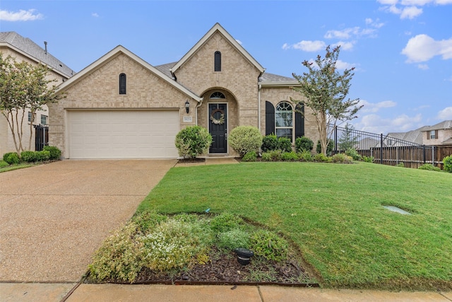 french country inspired facade with a garage and a front lawn