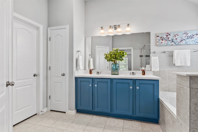 bathroom with tile patterned flooring, vanity, and plus walk in shower