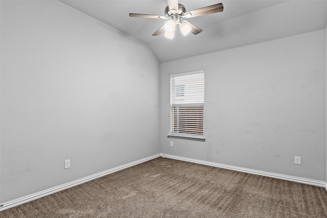 carpeted empty room featuring ceiling fan and lofted ceiling