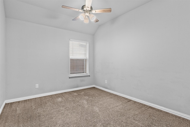 unfurnished room featuring ceiling fan, carpet, and lofted ceiling