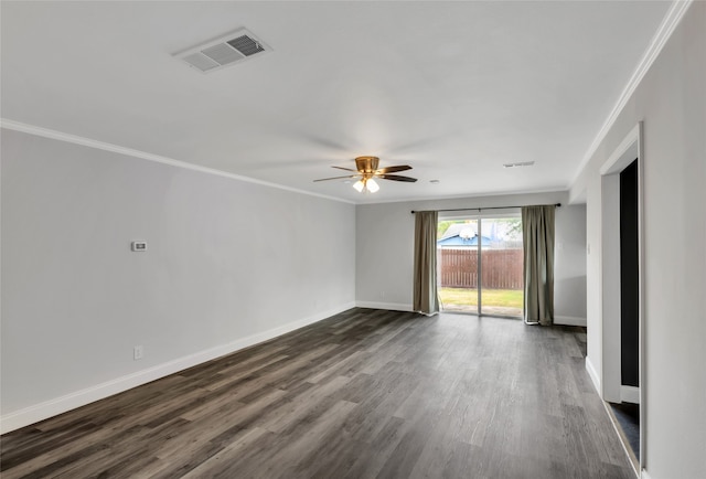 unfurnished room featuring dark wood-type flooring, ceiling fan, and crown molding