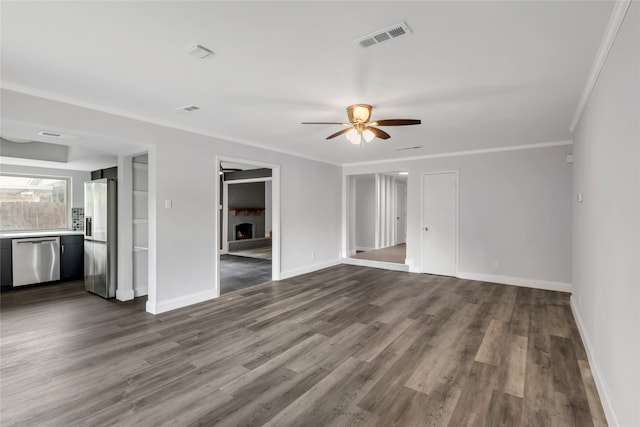 unfurnished living room featuring crown molding, hardwood / wood-style floors, and ceiling fan